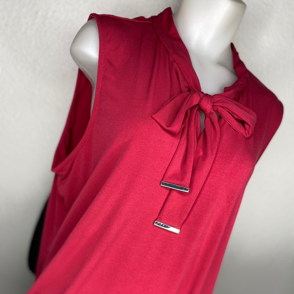 Red sleeveless bow tie top.